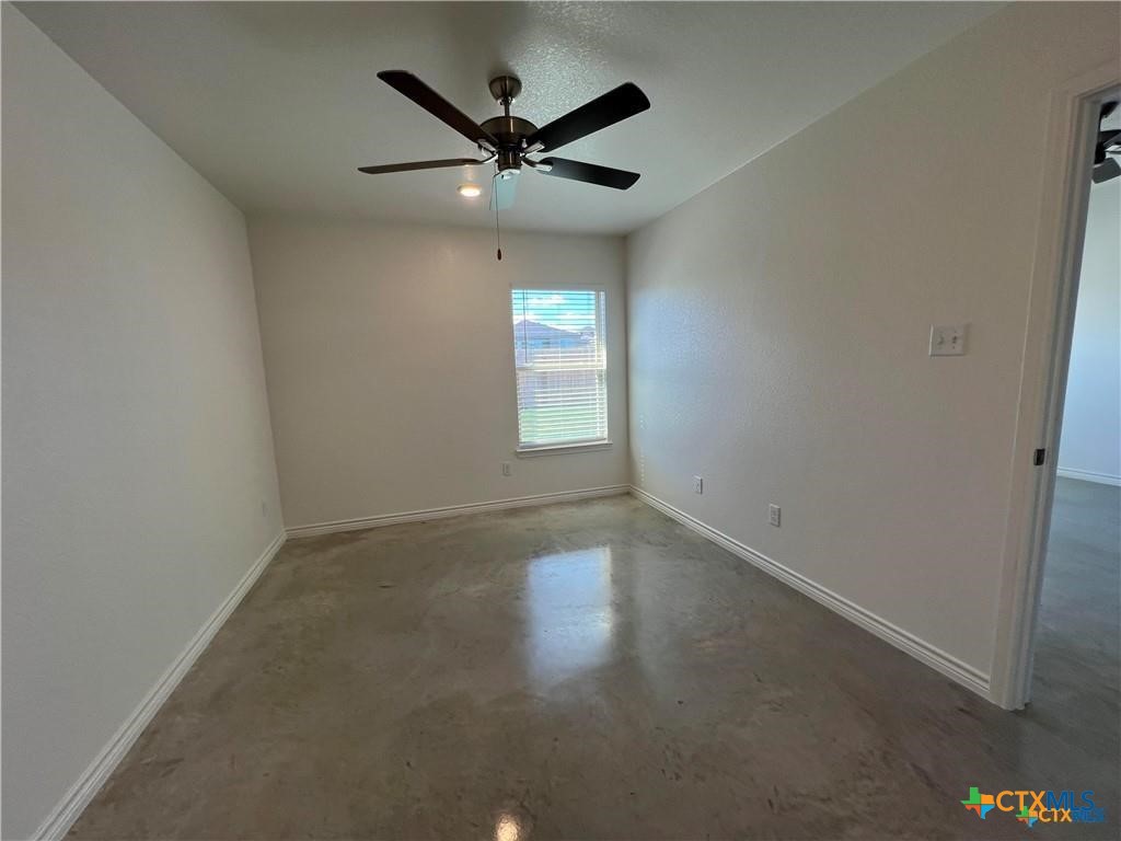 1274 Lehmann Drive, Unit A Copperas Cove, TX 76522 - Photo 4 of 8 an empty room with a window and a fan