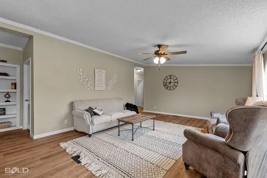 a spacious bedroom with a bed and a chandelier