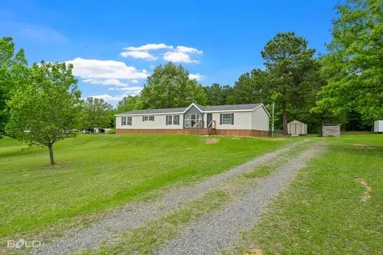 a view of a house with a big yard