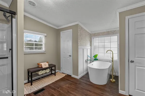 a view of an empty room with a ceiling fan and a window