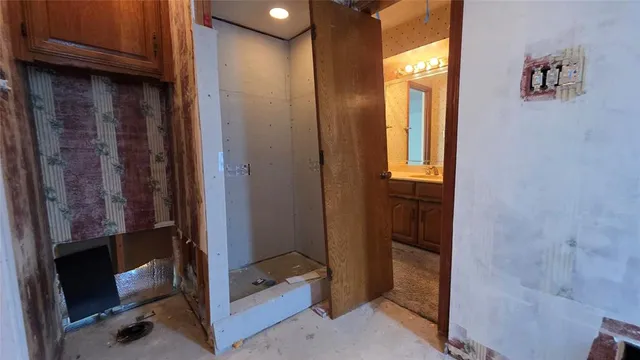 a view of a porch with a table and chairs