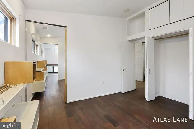 an empty room with wooden floor