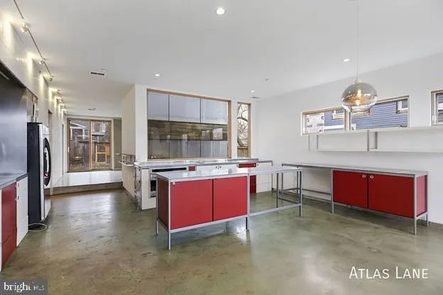 a kitchen with stainless steel appliances granite countertop a stove and a sink