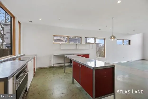 a lobby with a couch and a view of living room