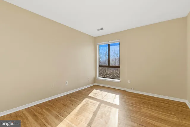 a view of an empty room and window