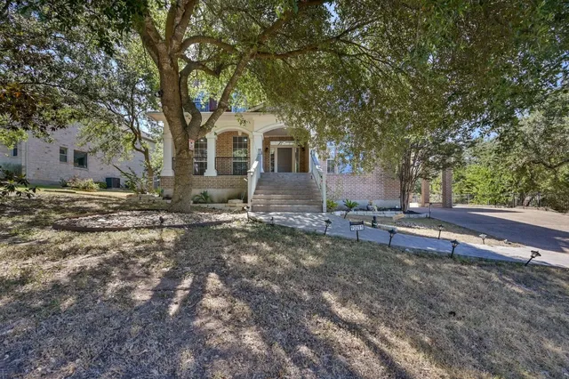 a front view of a house with a yard