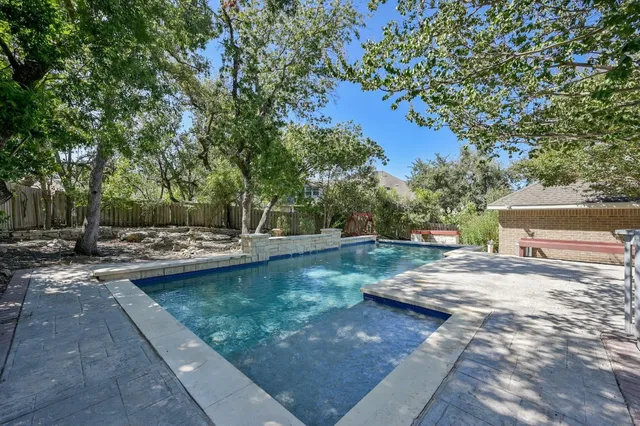 a view of a backyard with trees