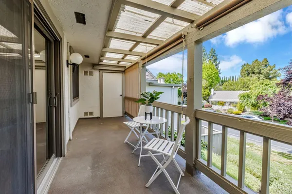 a view of a porch with furniture