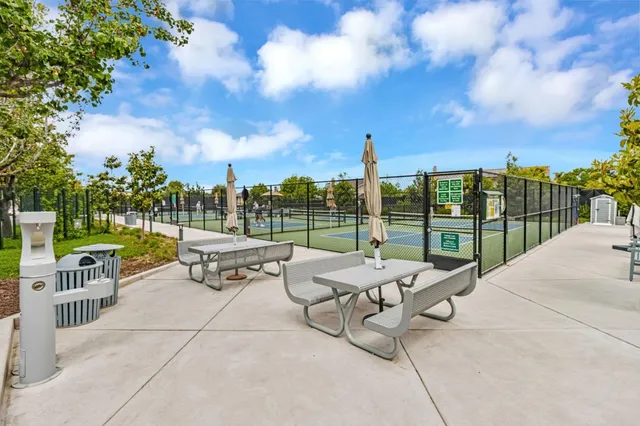 a view of a terrace with couches and sky view