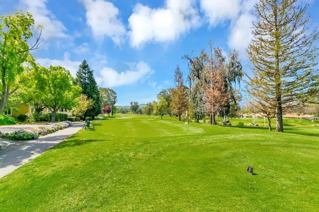 a view of a golf course with a big yard