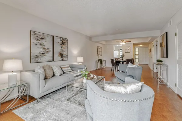 a living room with furniture and a table
