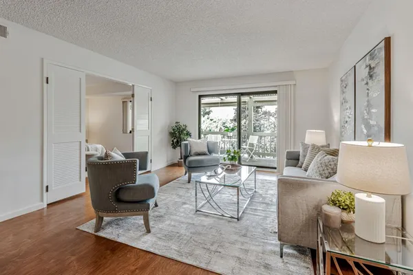a living room with furniture and a window