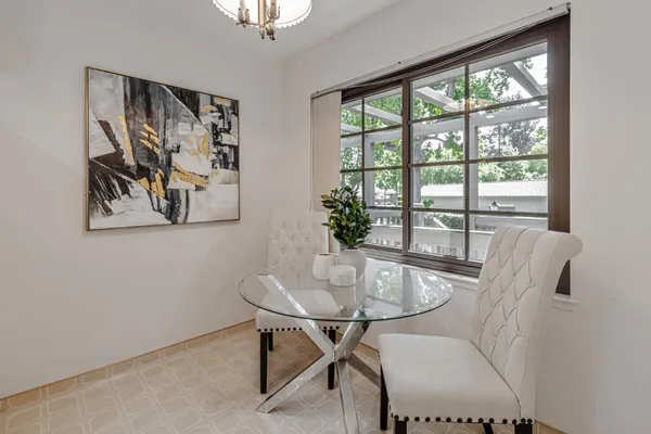 a view of a dining room with furniture window and outside view