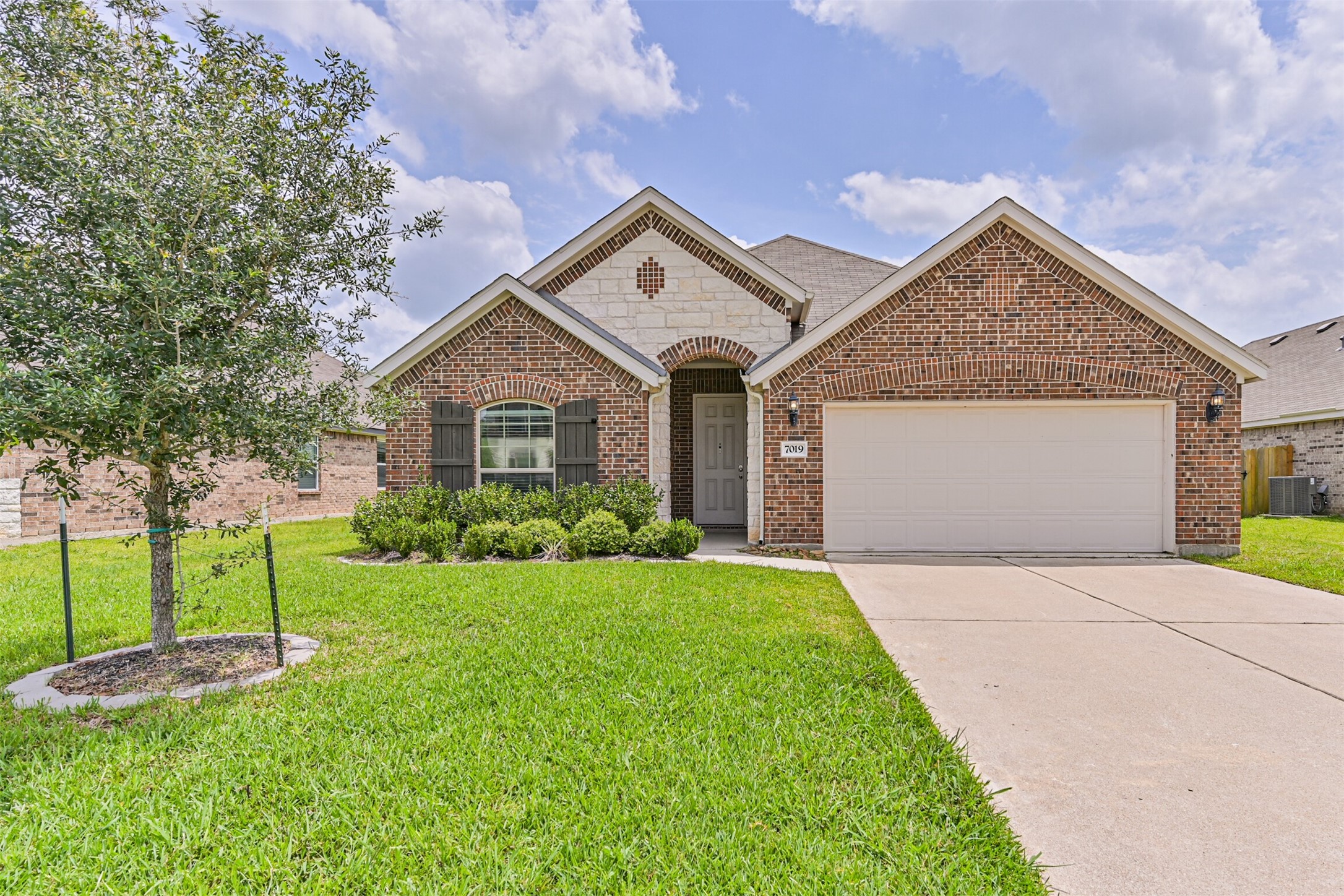7019 Terra Drive Manvel, TX 77578 - Photo 1 of 41 a view of a house with yard and tree s