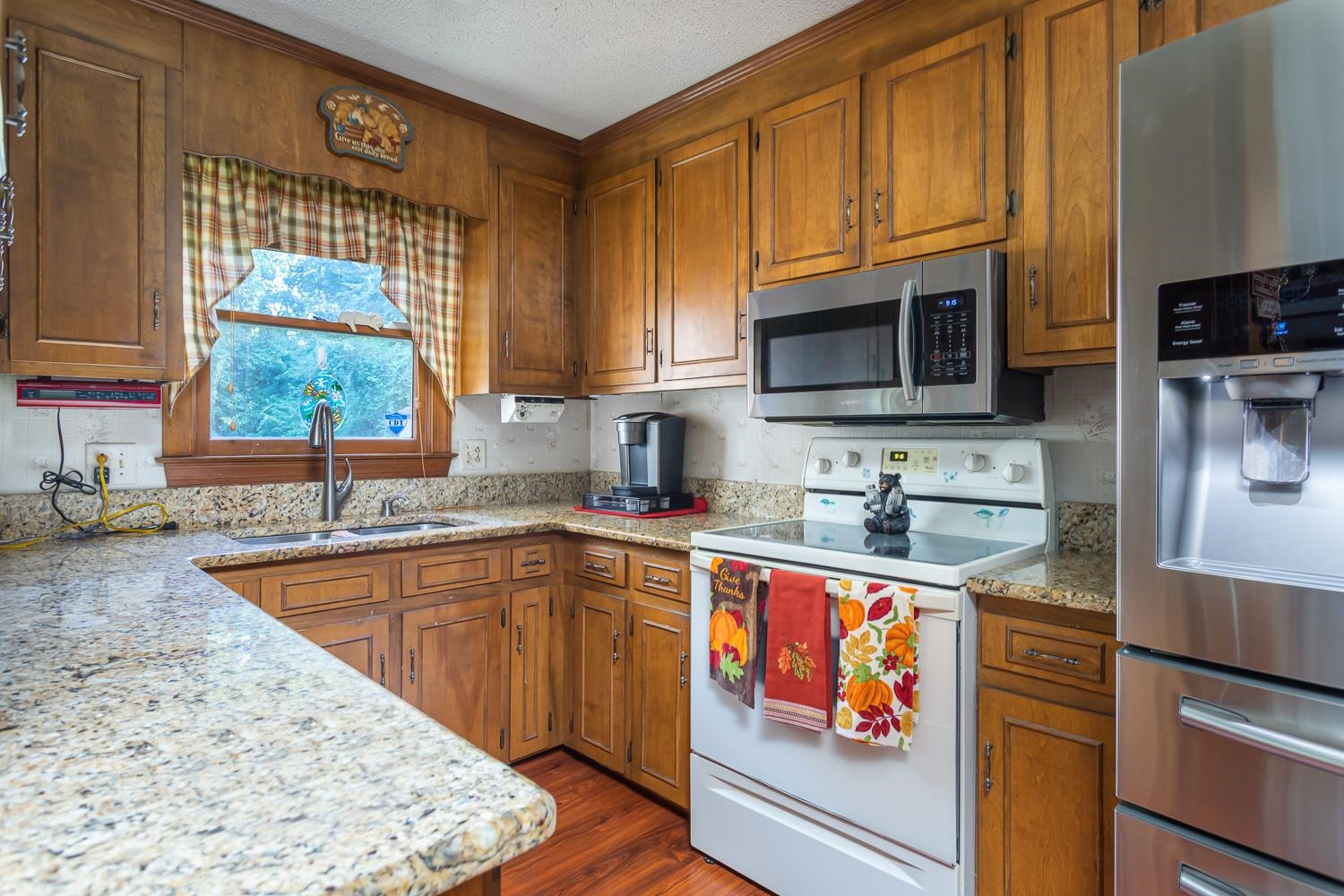 1301 Broken Branch Court Raleigh, NC 27610 - Photo 4 of 24 Granite Countertops. Range, Microware, Dishwasher & SS Refrigerator. Laminate Wood Floors Kitchen