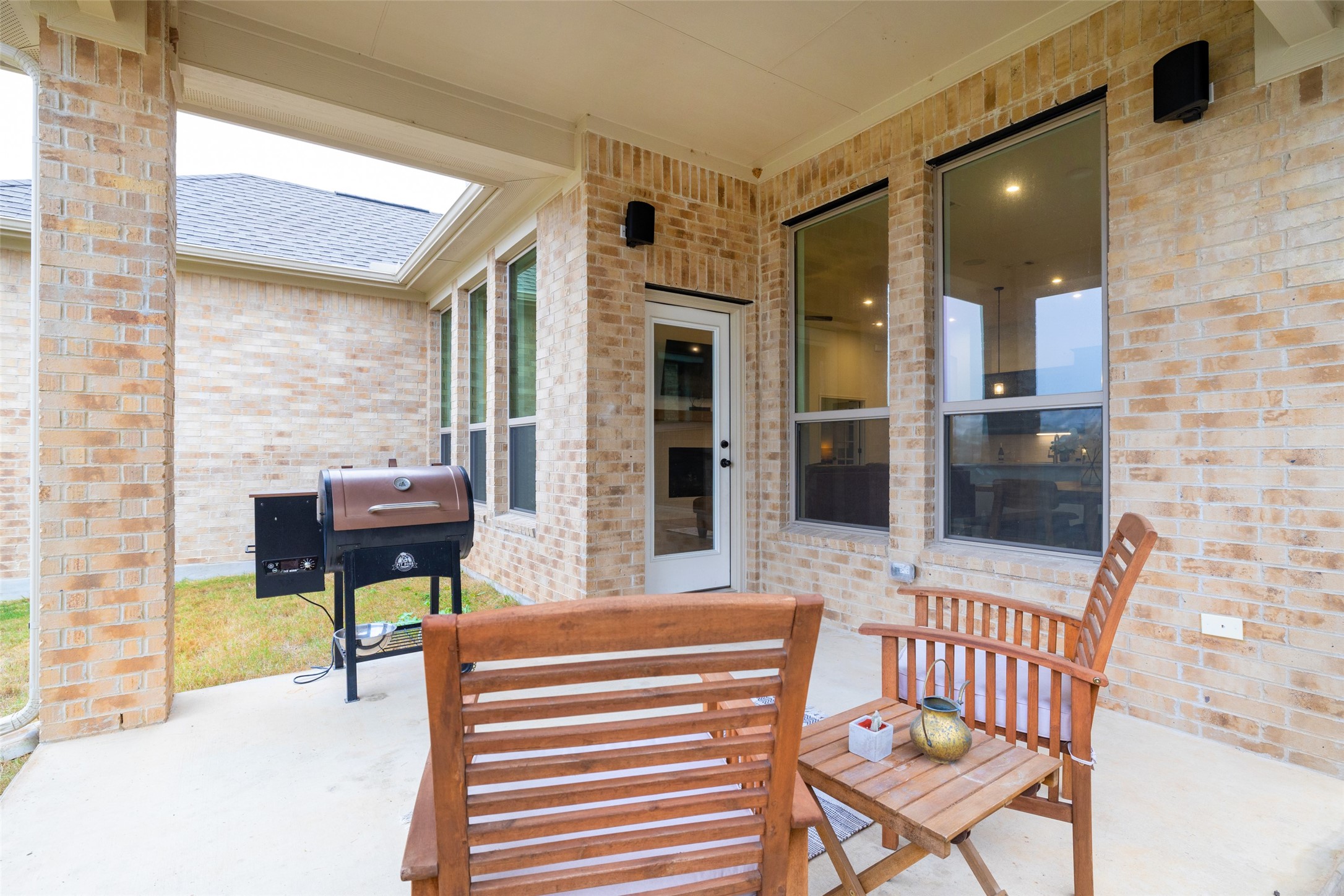 1117 Spring Gulch Lane Georgetown, TX 78628 - Photo 36 of 39 An inviting covered patio features ample space for outdoor cooking and relaxation.