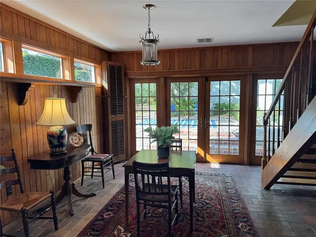a spacious bathroom with a granite countertop sink mirror and a bathtub