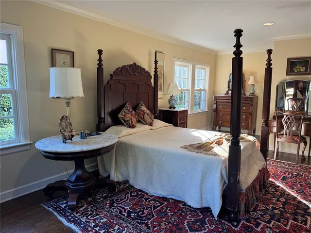 a bathroom with a tub a sink and mirror