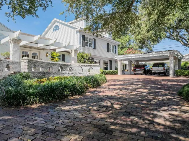 a front view of a building with garden