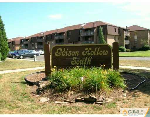 1419 Raspberry Court Edison, NJ 08817 - Photo 2 of 2 a sign on the side of a building
