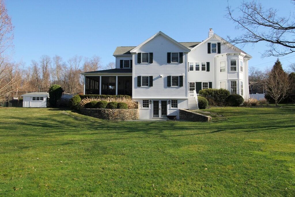 515 West Main Road Portsmouth, RI 02871 - Photo 3 of 50 Lovely expansive side yard has a patio with fire pit and entrance to lower floor.