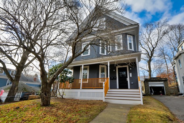 84 Maple Street, Unit 2 Boston, MA 02132 - Photo 1 of 15 a front view of a house with a tree