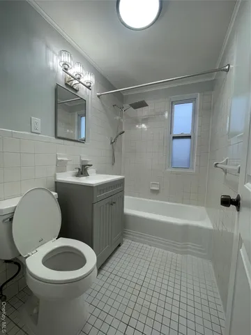a bathroom with a sink a toilet and bathtub