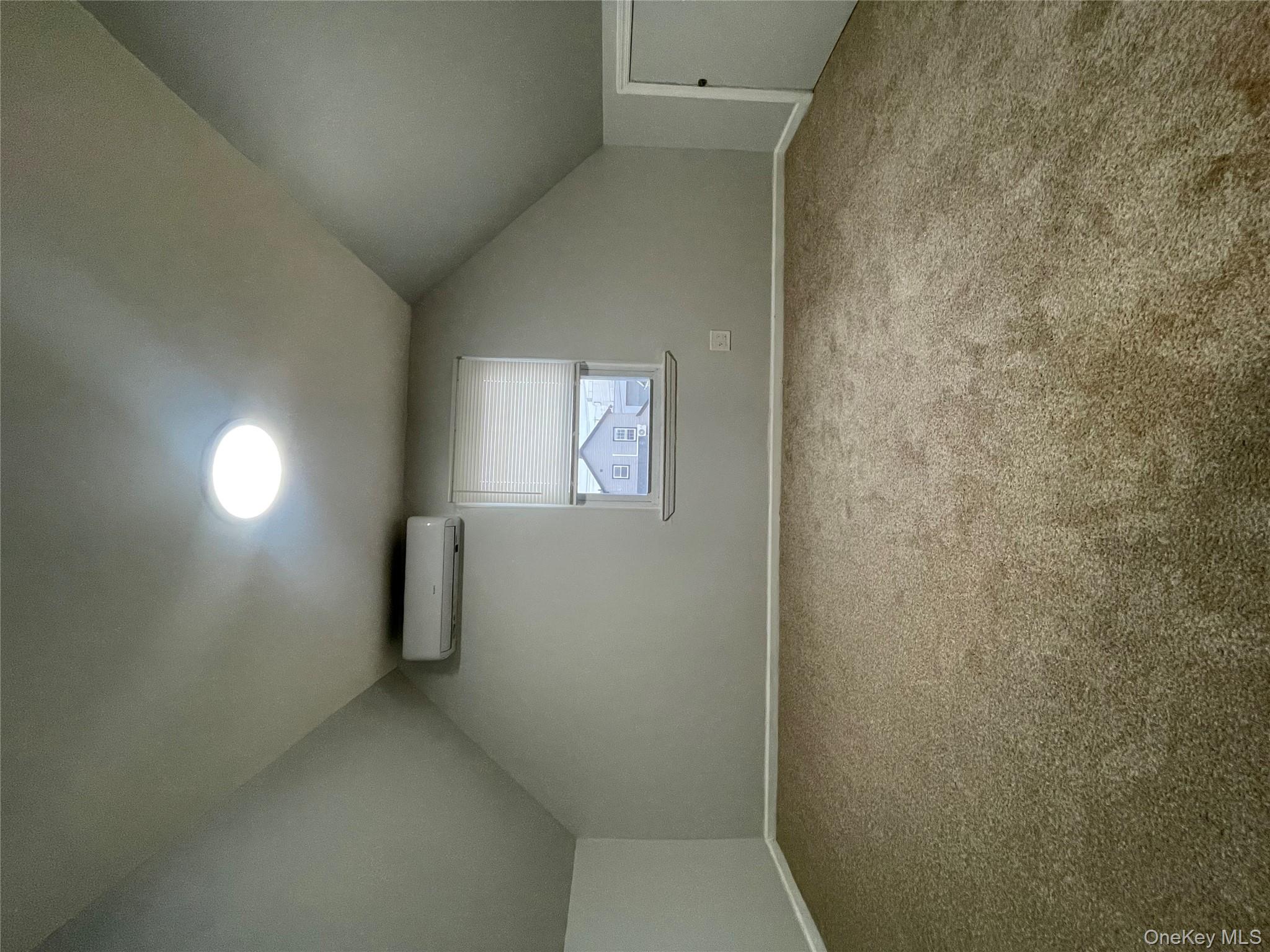 129-38 154th Street Queens, NY 11434 - Photo 4 of 10 a view of an empty room and a window