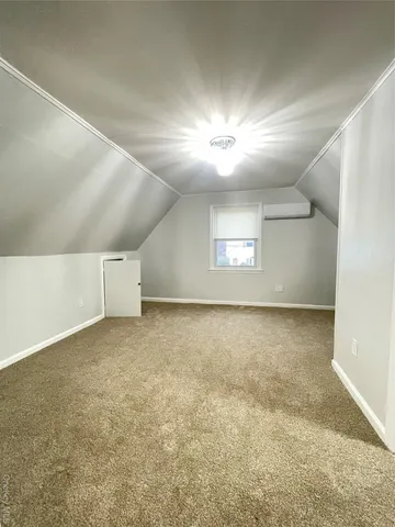 an empty room with a empty space and windows