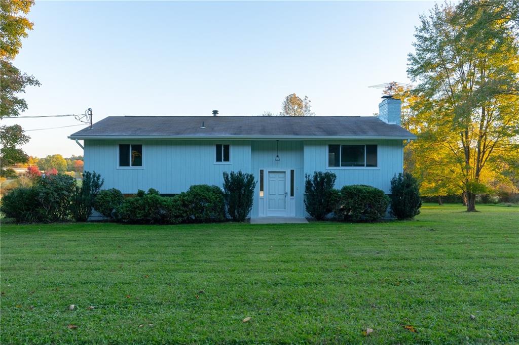338 Glen Eden Road Rochester, PA 15074 - Photo 20 of 23 a view of a house with backyard sitting area and garden