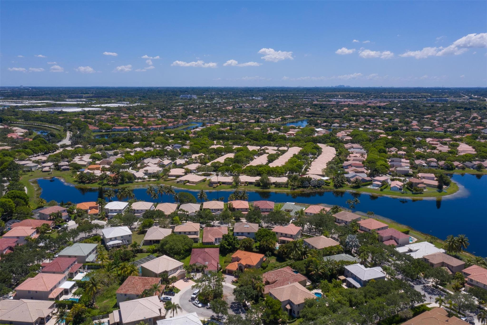 4452 Stone Ridge Way Weston, FL 33331 - Photo 12 of 65 an aerial view of city and lake
