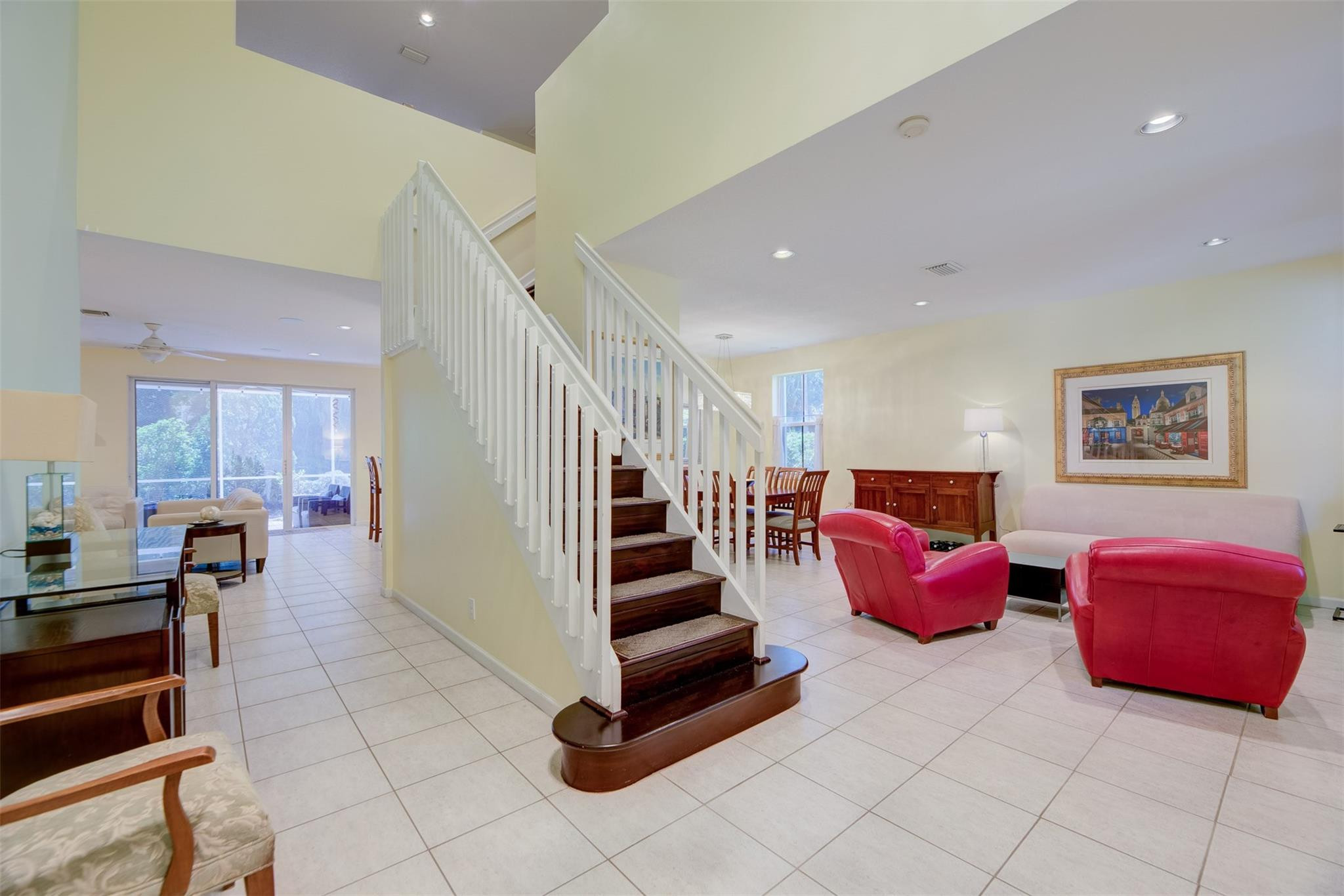 4452 Stone Ridge Way Weston, FL 33331 - Photo 19 of 65 a room with lots of furniture and stairs