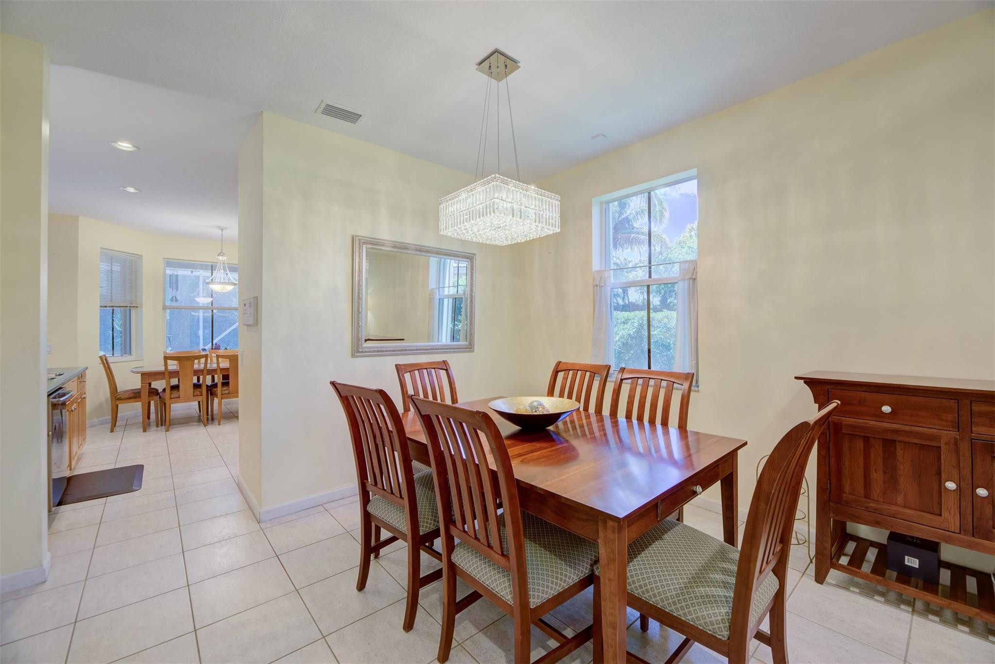 4452 Stone Ridge Way Weston, FL 33331 - Photo 23 of 65 a view of a dining room with furniture and chandelier
