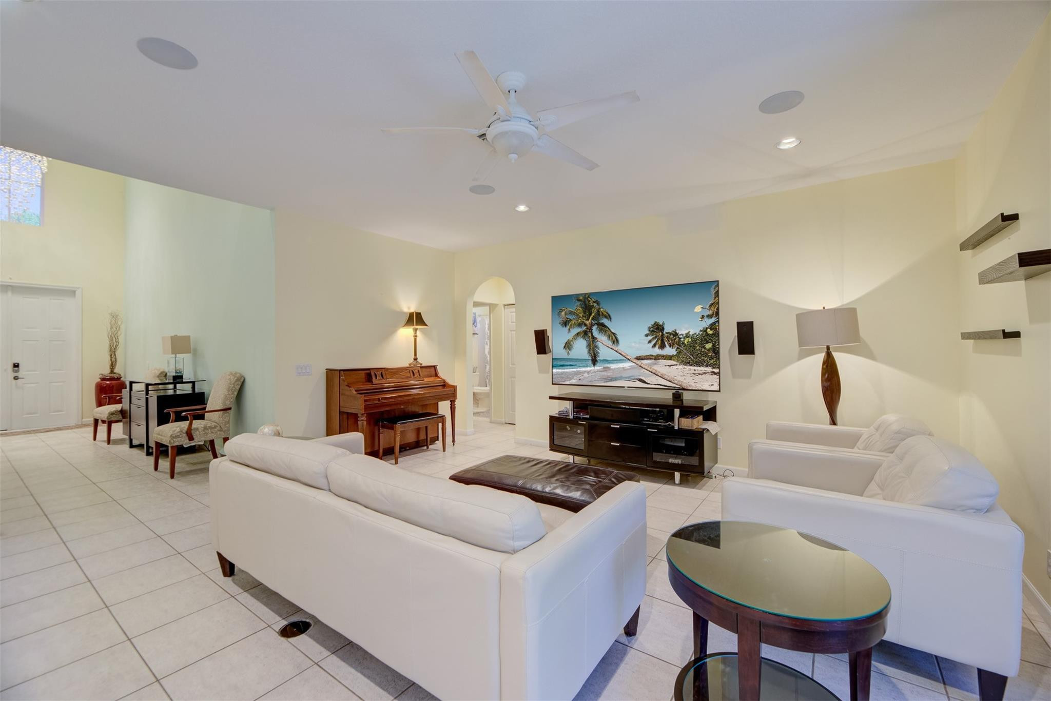 4452 Stone Ridge Way Weston, FL 33331 - Photo 26 of 65 a living room with furniture and a chandelier
