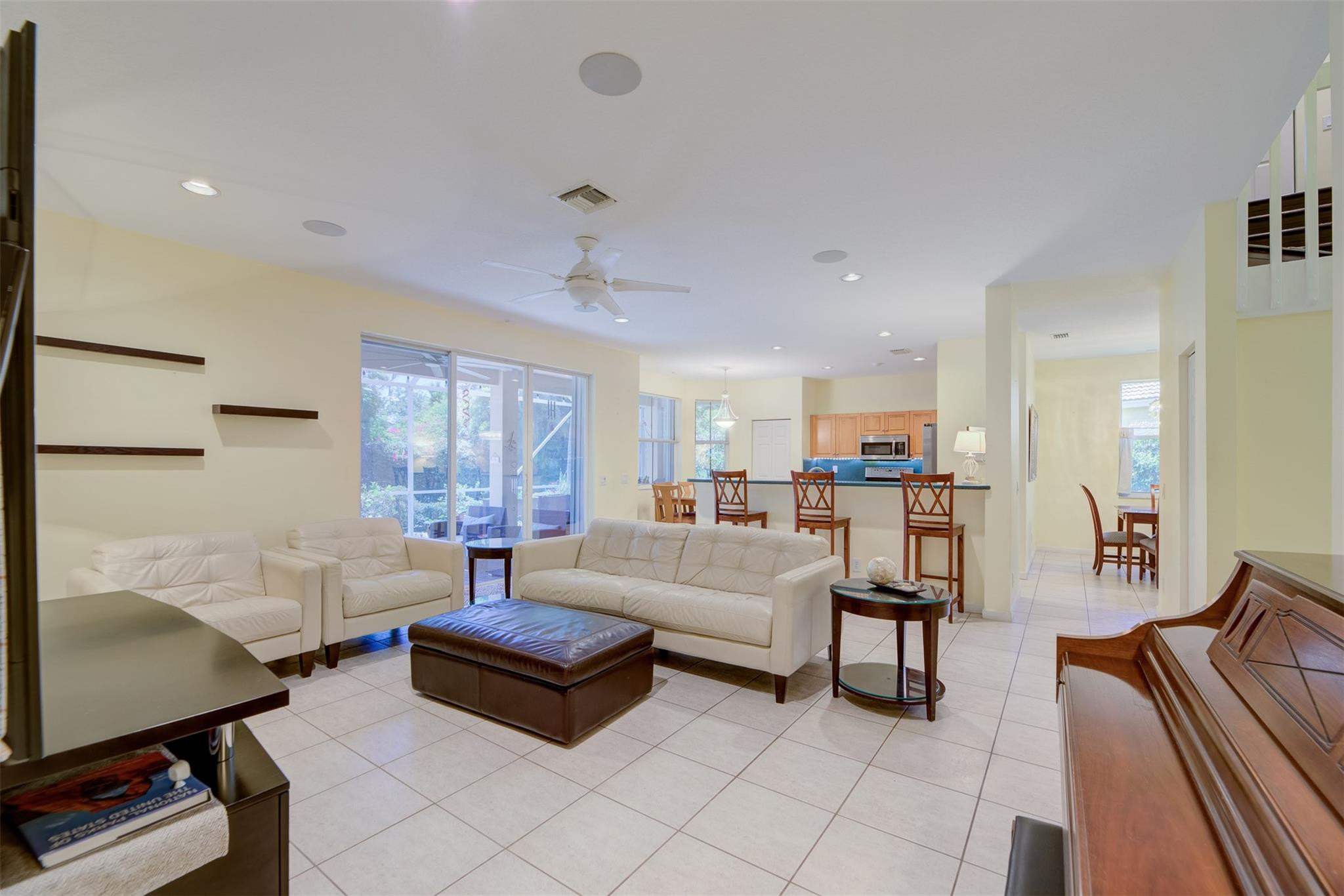 4452 Stone Ridge Way Weston, FL 33331 - Photo 27 of 65 a living room with furniture and a flat screen tv
