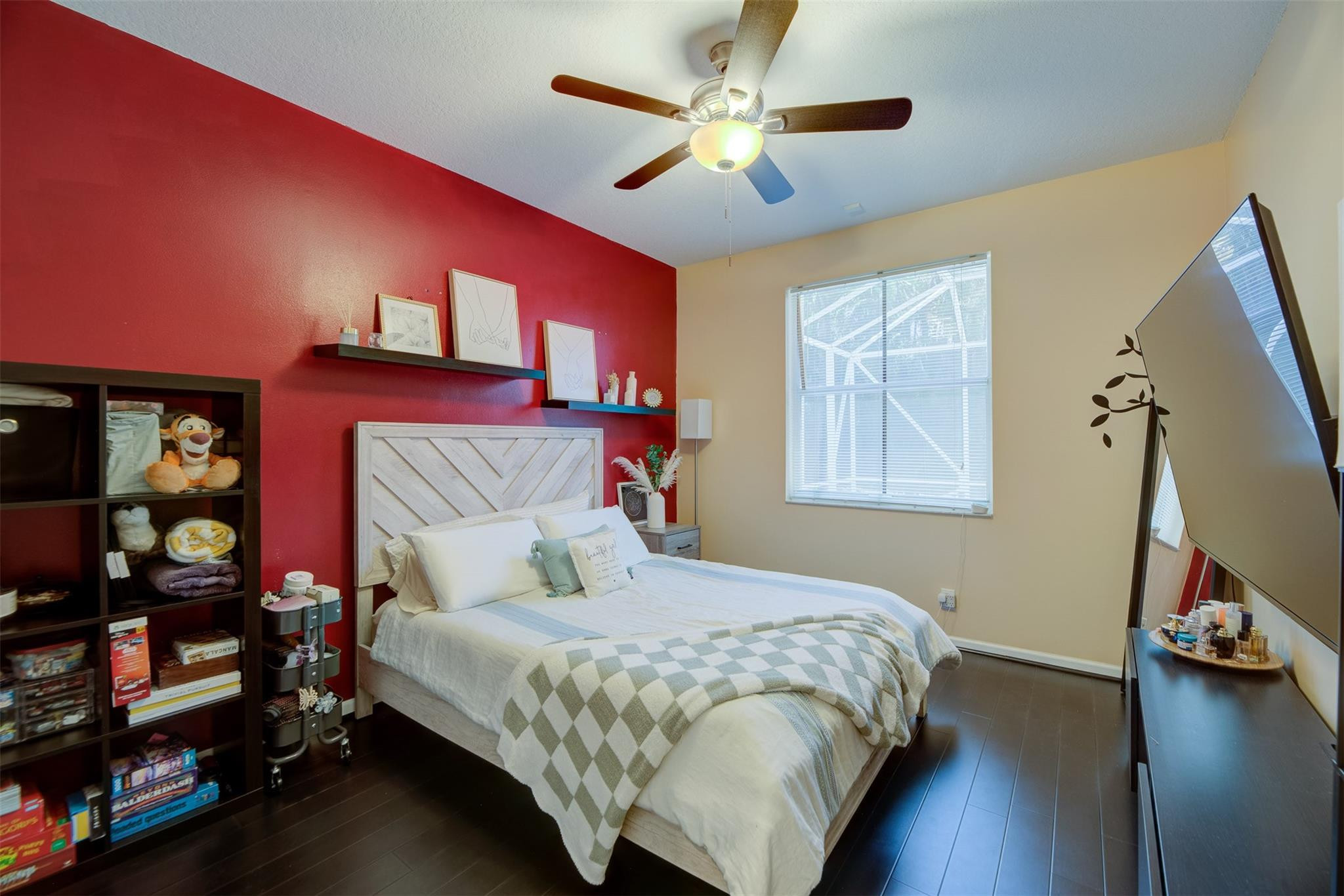4452 Stone Ridge Way Weston, FL 33331 - Photo 33 of 65 a bedroom with a bed and a chandelier