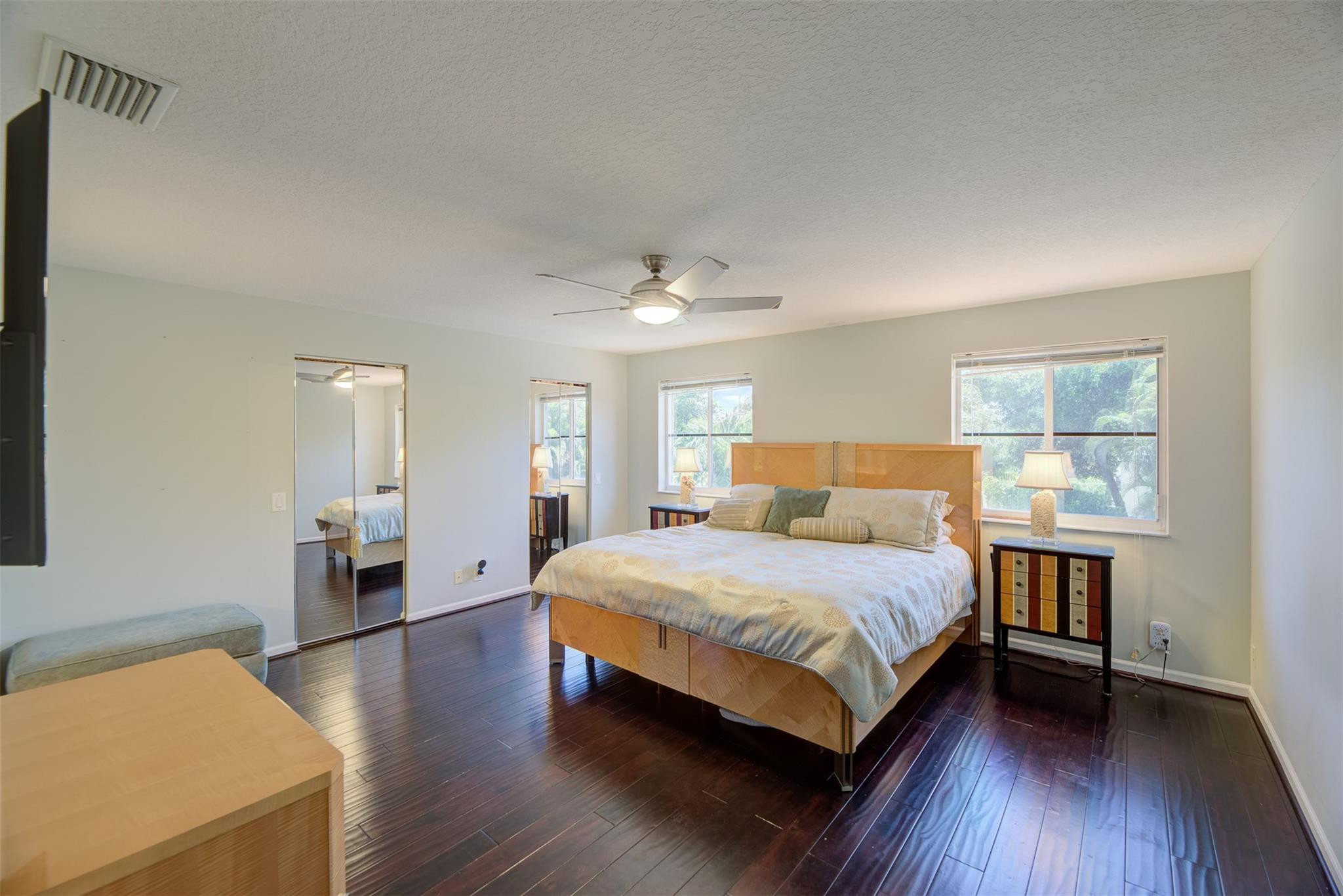 4452 Stone Ridge Way Weston, FL 33331 - Photo 36 of 65 a bedroom with a bed wooden floor and window