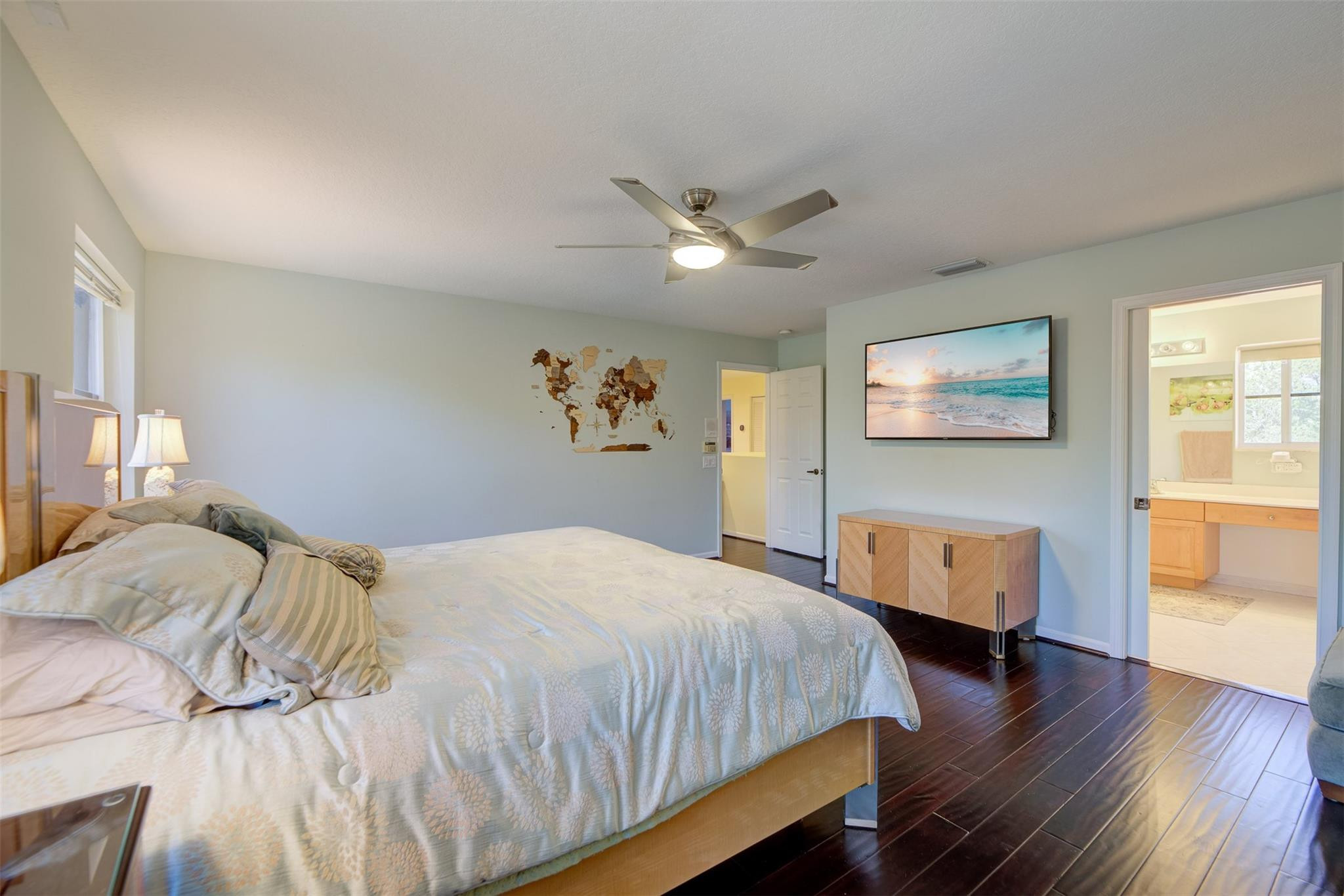 4452 Stone Ridge Way Weston, FL 33331 - Photo 38 of 65 a bedroom with a large bed and wooden floor