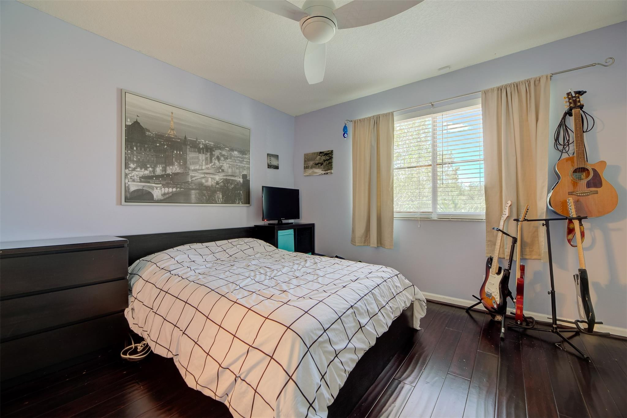 4452 Stone Ridge Way Weston, FL 33331 - Photo 44 of 65 a bedroom with a bed and a window