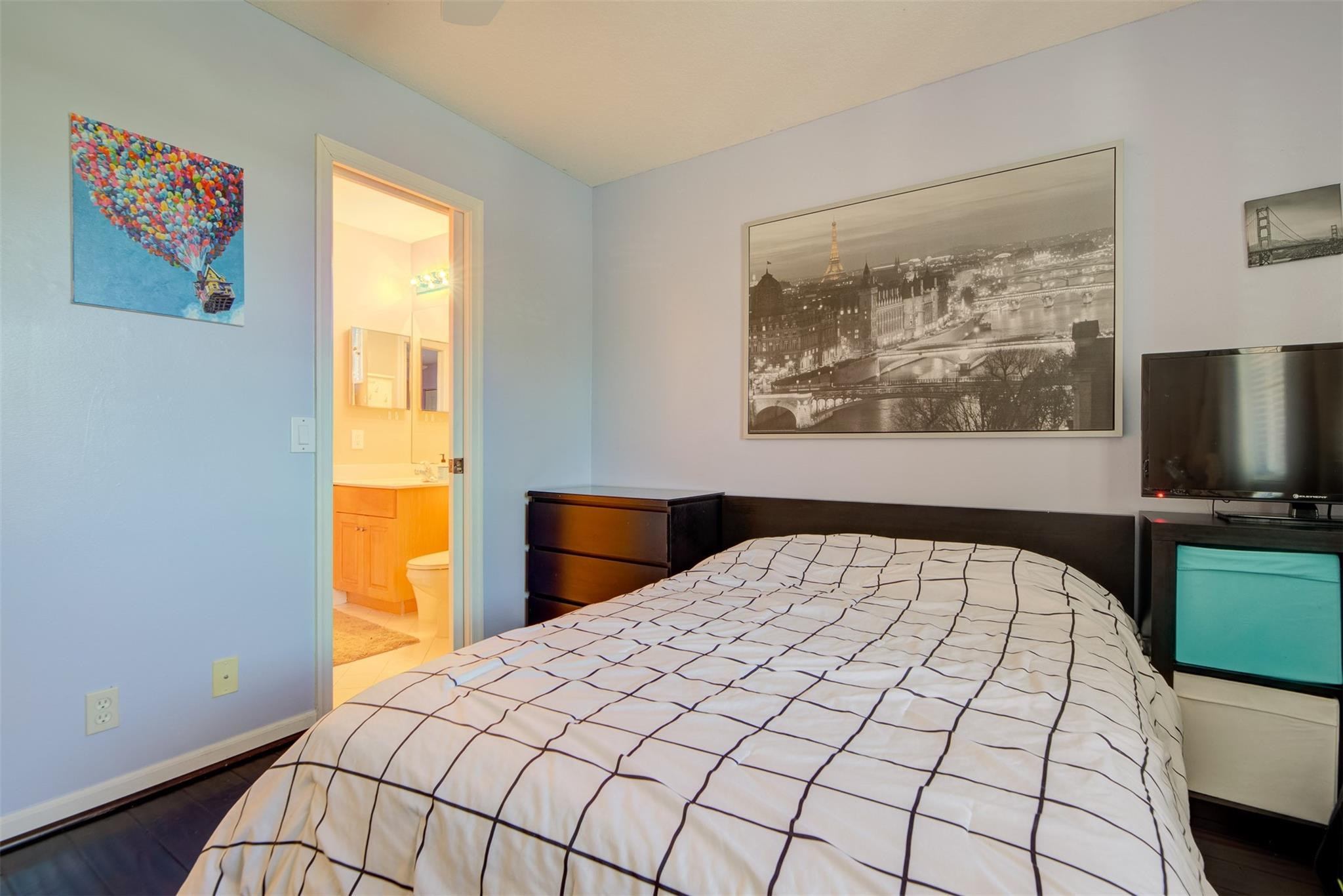 4452 Stone Ridge Way Weston, FL 33331 - Photo 45 of 65 a bedroom with a bed and a flat screen tv