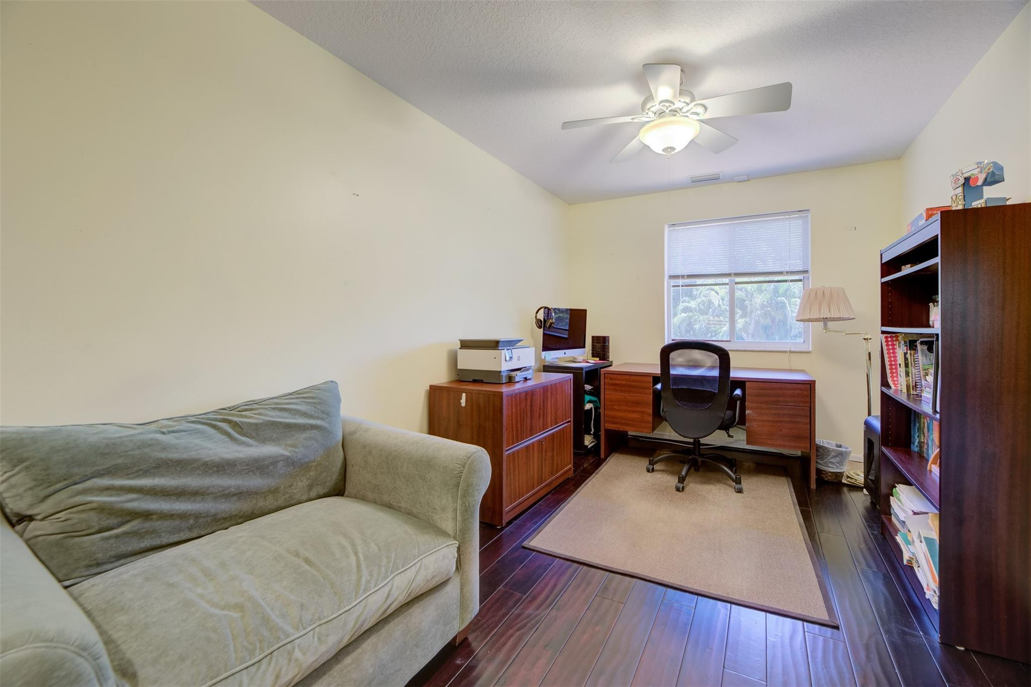4452 Stone Ridge Way Weston, FL 33331 - Photo 47 of 65 a living room with furniture and a flat screen tv