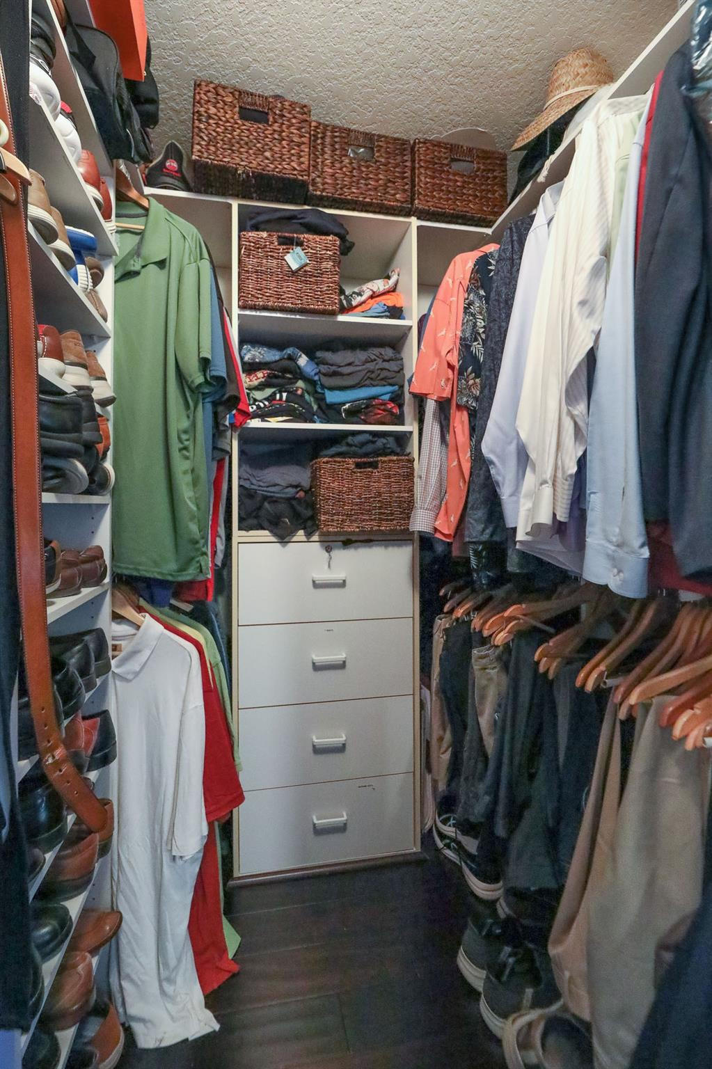 4452 Stone Ridge Way Weston, FL 33331 - Photo 48 of 65 a view of walk in closet with clothes and shoes
