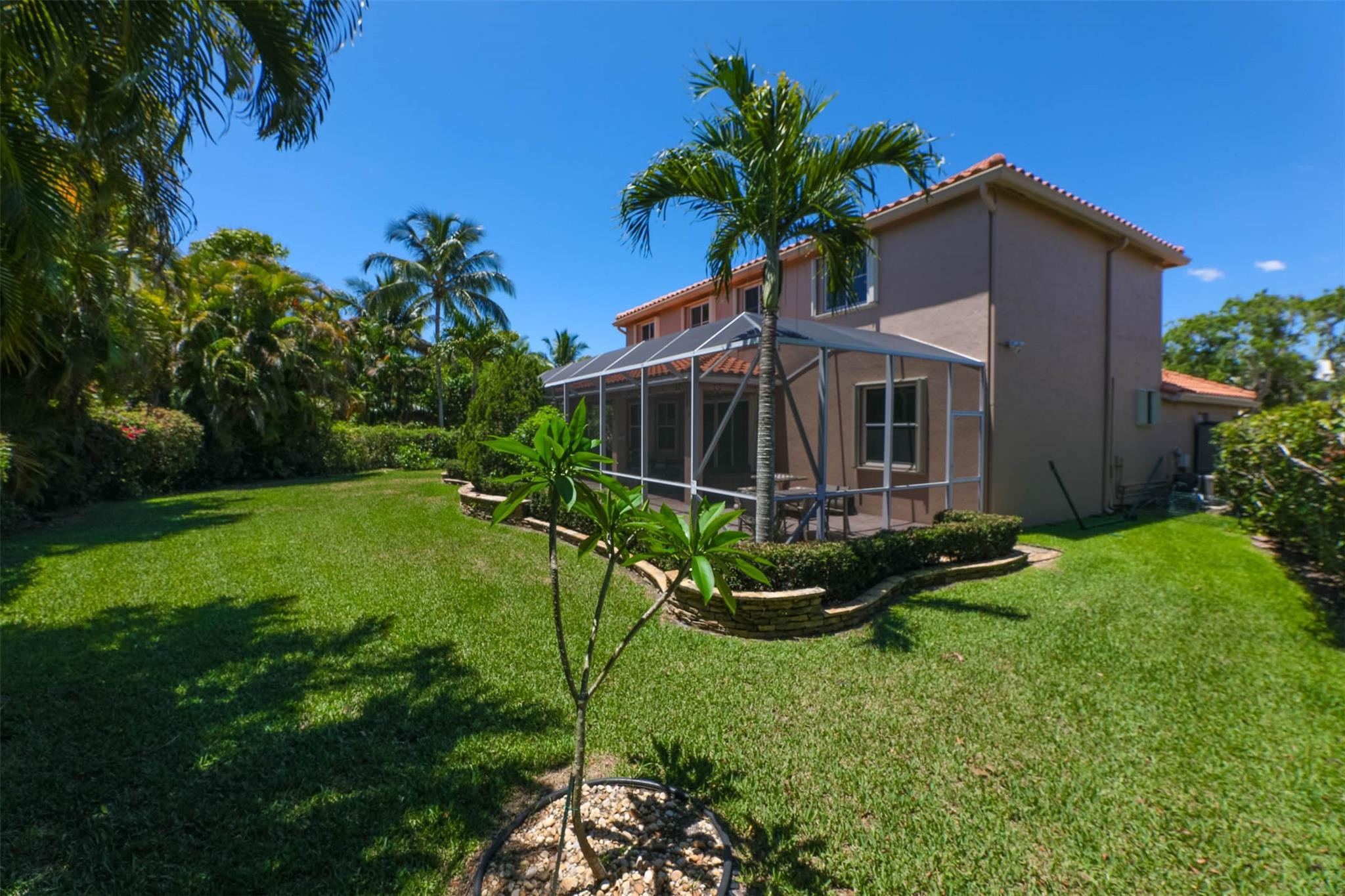 4452 Stone Ridge Way Weston, FL 33331 - Photo 57 of 65 a view of a house with backyard and garden