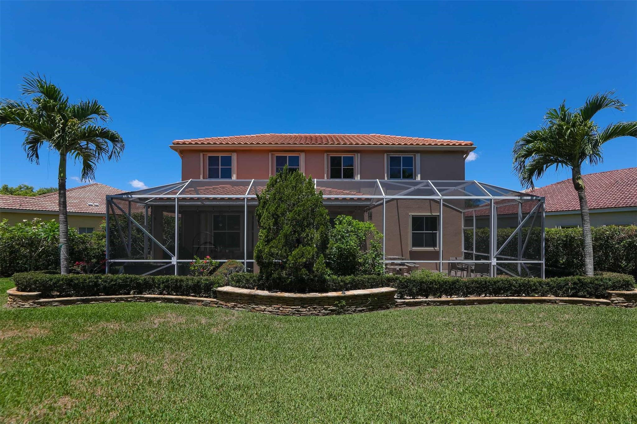 4452 Stone Ridge Way Weston, FL 33331 - Photo 58 of 65 a front view of a house with a yard