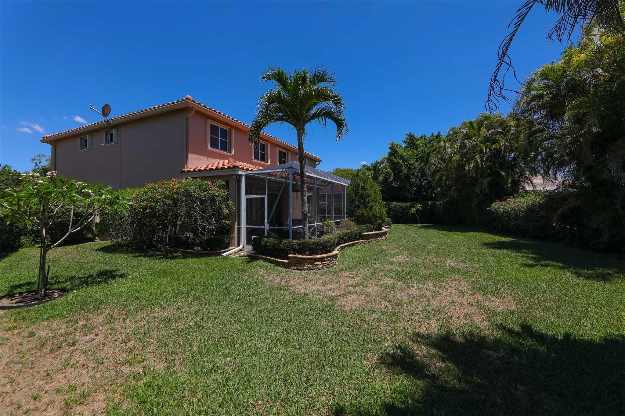 4452 Stone Ridge Way Weston, FL 33331 - Photo 59 of 65 a view of a house with backyard porch and garden