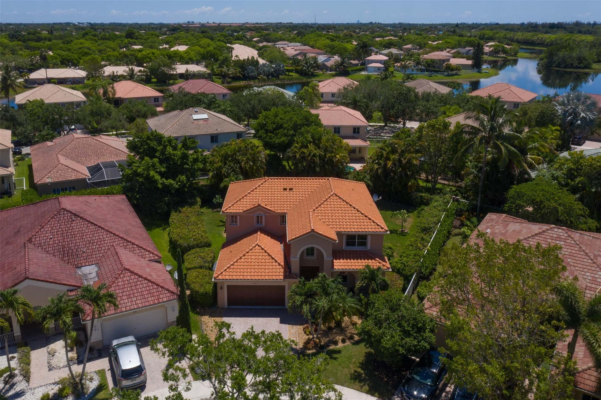 4452 Stone Ridge Way Weston, FL 33331 - Photo 6 of 65 an aerial view of a house with a garden