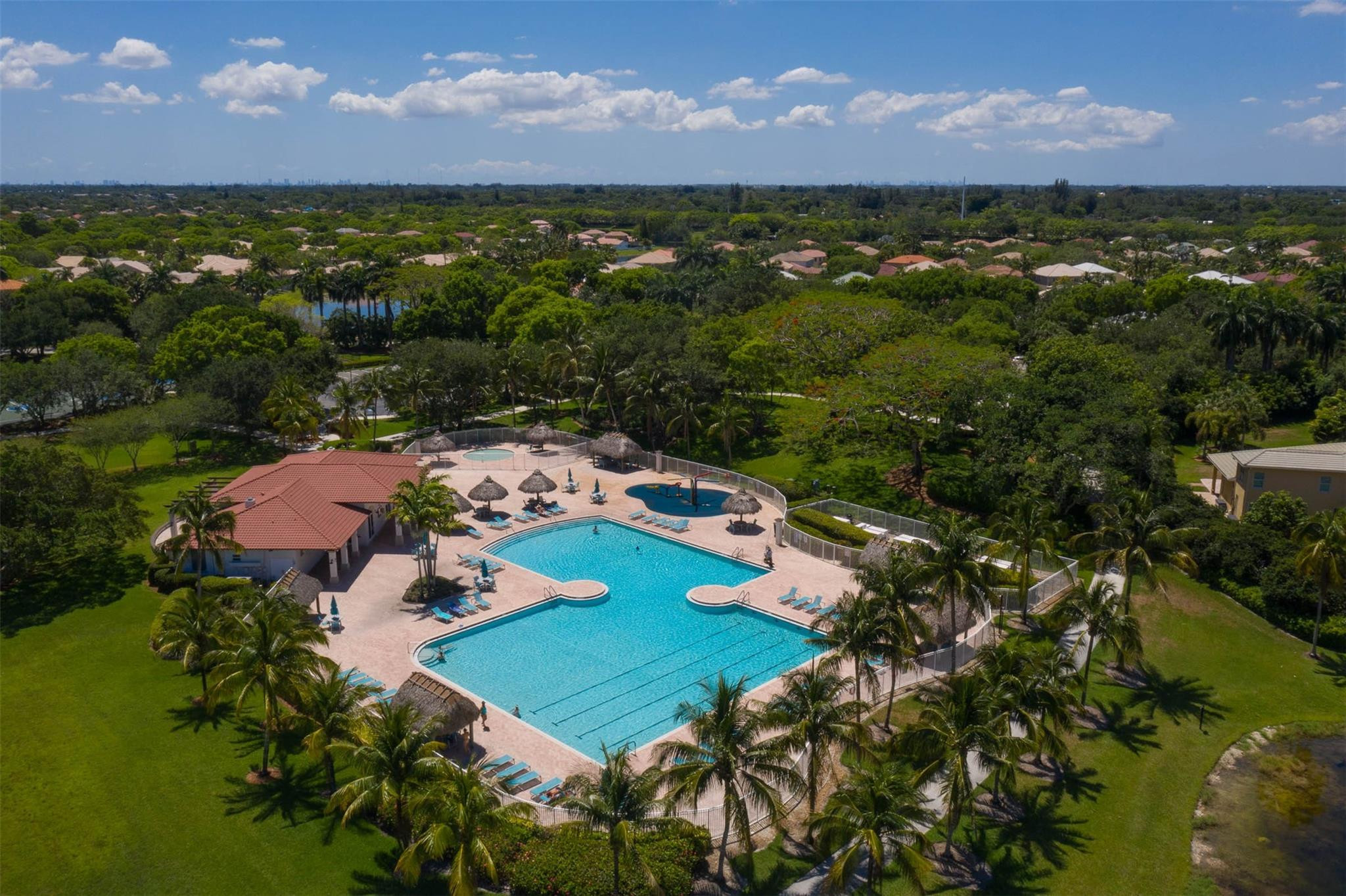 4452 Stone Ridge Way Weston, FL 33331 - Photo 63 of 65 an aerial view of residential houses with outdoor space and a lake view