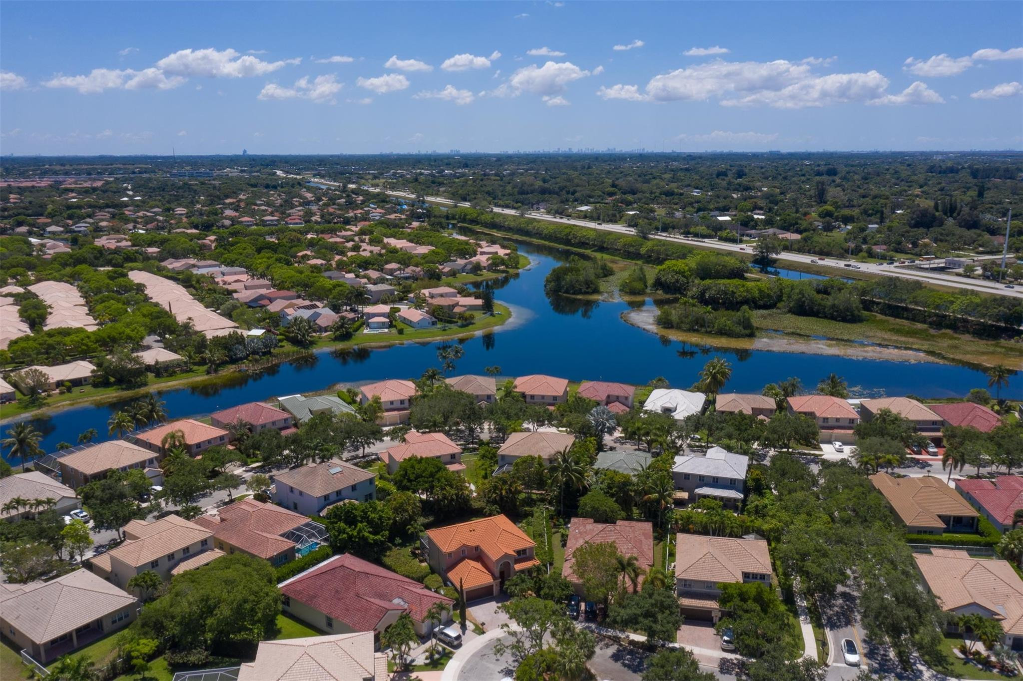 4452 Stone Ridge Way Weston, FL 33331 - Photo 10 of 65 an aerial view of a houses and city view