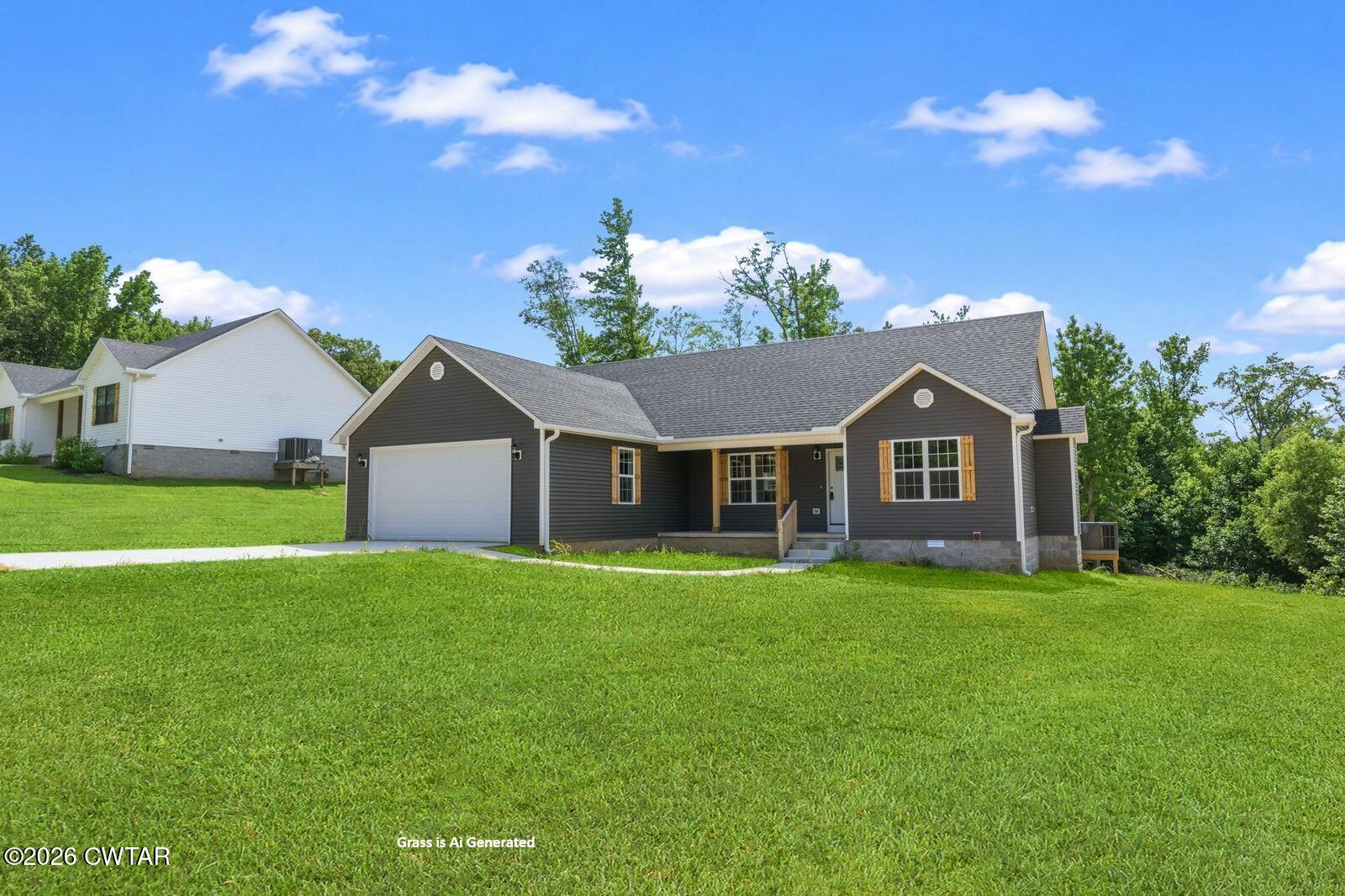 435 Old Huntingdon Road Lexington, TN 38351 - Photo 24 of 26 AiGeneratedGrassAddedtoSidePic