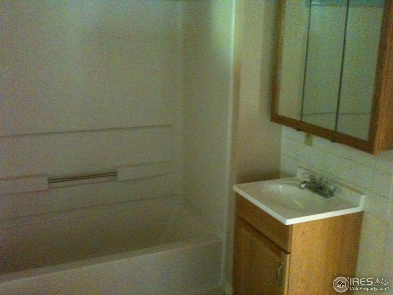 127 Platte Street Sterling, CO 80751 - Photo 3 of 4 a bathroom with a sink and vanity